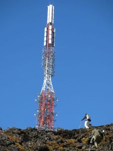 Josh and Bosco just below summit of Karasimbi (Radio/TV tower in the background)
